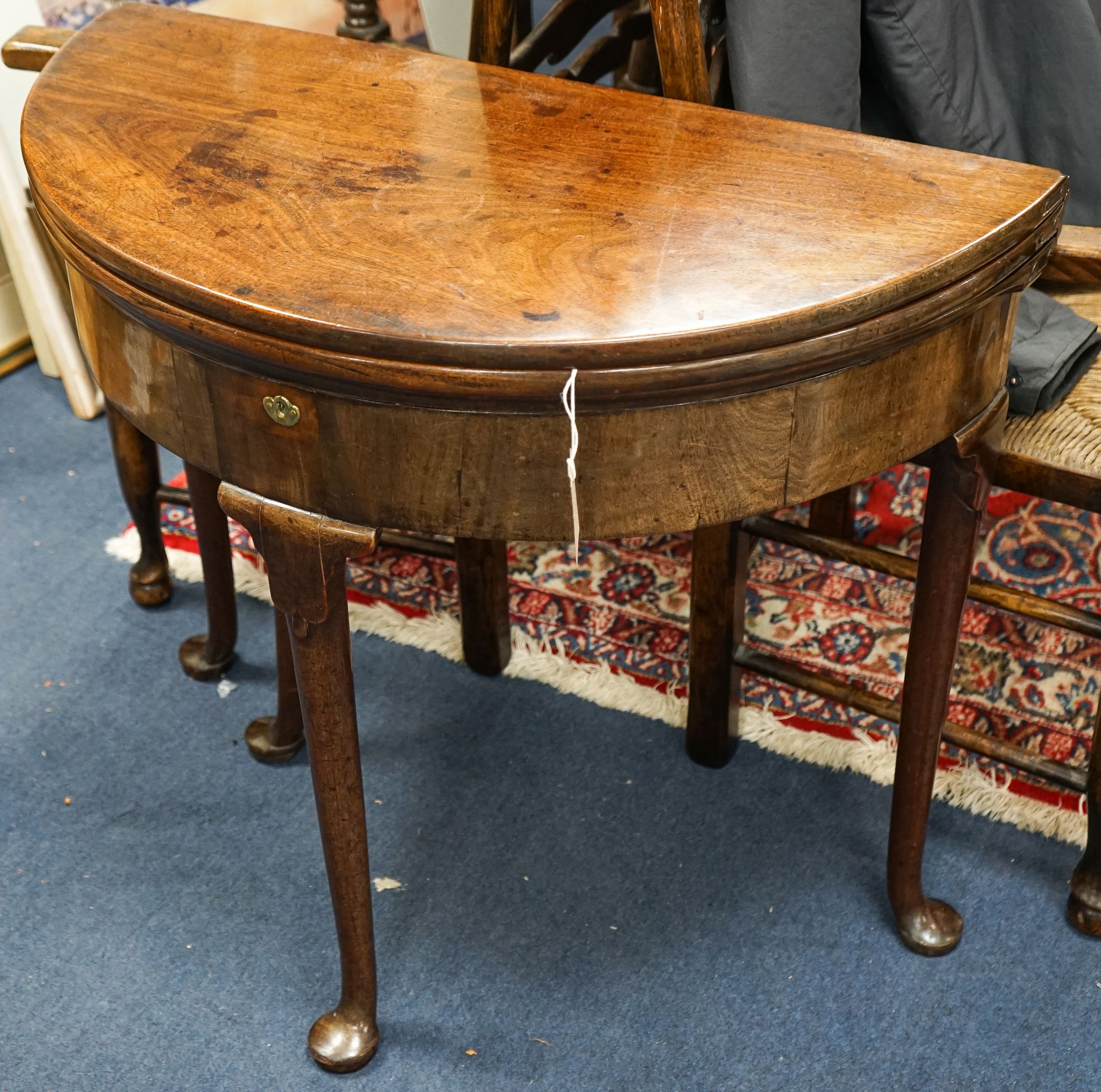 A George III mahogany demi lune folding tea table, width 97cm, depth 39cm, height 71cm